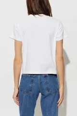 Remera blanca de algodón con corte boxy, ligeramente oversize, de líneas rectas y mangas cortas, con cuello redondo acanalado.