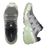Calzado de trekking Salomon modelo Speedcross 6, en tonos gris y verde claro, diseñadas para trail running con suela de gran tracción y cordones de ajuste rápido.