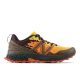 Championes de trail running New Balance Fresh Foam X Hierro v7, con diseño multicolor en tonos naranja, verde y negro. Presentan entresuela Fresh Foam X para máxima amortiguación y suela Vibram Megagrip para tracción superior en terrenos irregulares. Empeine de malla transpirable con refuerzos sintéticos.