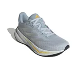 Championes de running Adidas Response color gris claro con detalles plateados y suela blanca con detalles en amarillo y negro. Presentan las tres tiras clásicas de Adidas en los laterales y capellada de malla transpirable.