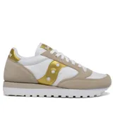 Championes Saucony Jazz Original de dama, color blanco con detalles en dorado y beige.