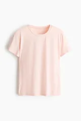 Remera de deporte DryMove de color rosado claro, con cuello redondo y mangas cortas.