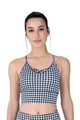 Top deportivo Everlast con estampado houndstooth en blanco y negro, escote redondo con tiras cruzadas y tirantes finos.