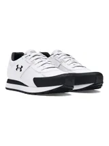 Championes Under Armour modelo Essential Runner, de diseño retro en color blanco con detalles en negro. Presentan parte superior de nailon con revestimientos de gamuza, entresuela de EVA acolchada y suela de goma para mayor tracción.