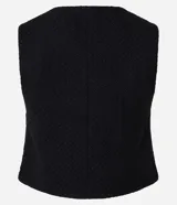 Chaleco blanco de tweed con cuello redondo, abotonado en el frente y corte entallado.