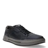 Championes urbanos Democrata modelo Nosu, confeccionados en cuero azul marino con detalles en marrón tabaco. Presentan cierre acordonado, costuras reforzadas y suela de goma en tono gris.