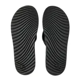 Ojotas Rip Curl modelo Tunnels Bloom de color negro, con diseño ergonómico de suela texturizada y tiras de dedo con el logo de la marca estampado.