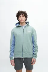 Canguro negro con mangas en color crema y estampado en la espalda con la frase "The sound of waves breaking on the shore".