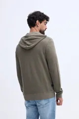 Campera canguro de algodón color beige con capucha, cierre frontal y bolsillos laterales, confeccionada con felpa diferenciada.