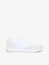 Zapatillas de piel Tommy Hilfiger de corte bajo, color blanco con paneles de ante en tono gris claro, inspiradas en modelos de running retro con suela de EVA y detalles distintivos.