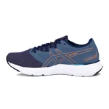Championes Asics Fuzeblast Se, de color azul marino con detalles en naranja brillante y suela blanca. Diseñados para running y entrenamiento, confeccionados con malla transpirable y refuerzos sintéticos.