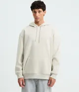 Hoodie de algodón afelpado color beige, con capucha con cordón ajustable, bolsillo estilo canguro y puños y dobladillo elásticos.