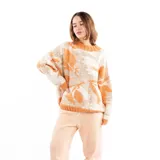 Buzo de tejido jacquard con diseño orgánico inspirado en el ceibo, de calce relajado, cuello alto y terminaciones tejidas en rib.
