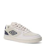 Championes urbanos Umbro modelo Milo, con diseño de paneles en tonos beige y blanco, y detalles en azul marino en el talón y logo lateral. Presenta puntera perforada y suela de goma al tono.
