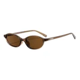 Lentes de sol Hanoi con armazón ovalado de acetato en color marrón traslúcido y cristales en tono marrón.