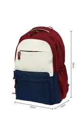 Mochila de tela con diseño tricolor, combinando secciones en color bordó, blanco crudo y azul marino. Presenta múltiples compartimentos con cierres de cremallera y tiradores de cordón.