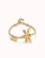 Pulsera dorada elástica con dije de libélula y dije rectangular con la inscripción "Sweet".