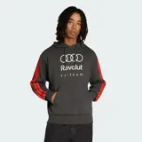 Canguro Adidas de felpa francesa color gris oscuro, con capucha y cordón de ajuste. Presenta estampado frontal con logos de Audi, Revolut y F1 Team, además de las icónicas tres tiras de la marca en color rojo a lo largo de las mangas.