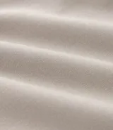 Pantalón deportivo de hombre color beige, liso, con ajuste elástico en la cintura y bolsillos laterales.