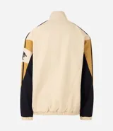 Campera de sarga de algodón marca Blue Steel, con diseño de bloques de color en tonos beige, negro y mostaza. Presenta cuello alto, cierre frontal con botones a presión y solapa, bolsillos laterales y detalles de parches bordados con temática outdoor en el pecho y la manga.
