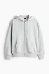 Campera con capucha y cierre frontal de H&M, color gris melange, con hombros caídos, bolsillos tipo canguro y ajuste oversized.