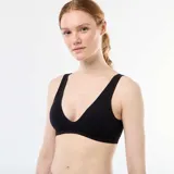 Pack de dos bralettes de microfibra acanalada, uno blanco y otro negro, sin costuras y con breteles anchos.