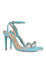 Sandalias de fiesta color amarillo flúor con taco aguja alto, tira delantera con apliques de strass y pulsera al tobillo con hebilla.