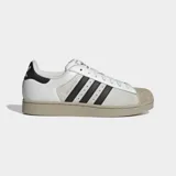 Championes Adidas Superstar II de diseño clásico con paneles divididos de cuero blanco y gamuza gris, con las icónicas tres tiras negras en el lateral, puntera de goma y suela en tono tostado.