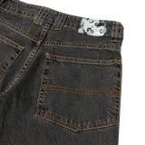 Pantalón de jean negro con lavado stonewash, corte baggy recto, tiro medio, bolsillos delanteros grandes con bordado.