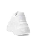 Championes blancos con plataforma alta y suela con diseño irregular.