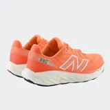 Championes de running New Balance modelo 880 v14, color naranja con detalles en blanco. Presentan una parte superior de malla técnica transpirable y una entresuela de doble capa con tecnología Fresh Foam X para mayor amortiguación.