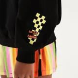 Buzo de cuello redondo y corte oversize, color negro, con estampa frontal multicolor con el logo de la marca y detalle en la manga.