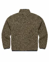 Campera de sherpa color marrón con cierre frontal, cuello alto y bolsillo en el pecho con cierre. Presenta detalles en color azul marino en los bordes y cierres, y un parche decorativo en el bolsillo superior.