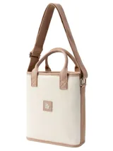 Matera modelo Cadiz con diseño a rayas en tonos beige, blanco y marrón, asas cortas de mano y correa larga ajustable para el hombro.