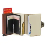 Billetera tarjetero Baleine Alabama de cuero marrón y blanco con mecanismo pop-up para tarjetas.