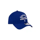 Gorra azul con visera curva y logo bordado de los LA Dodgers en el frente.