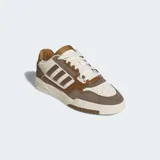 Championes Adidas Drop Step Low 2.0 color marrón, blanco y gris. Zapatillas de corte bajo que mezcla gamuza y piel sintética en la parte superior y se apoya en una suela esculpida.