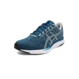 Championes Asics modelo Streetwise, color negro con detalles en gris y suela blanca. Diseño deportivo con tejido transpirable y logo lateral característico de la marca.