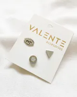 Set de tres pares de aros Valente de acero plateado. Incluye un par con forma de ojo, un par con forma de triángulo y un par con un cristal engarzado.
