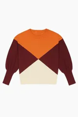 Sweater de tejido de punto con diseño geométrico en bloques de color naranja, borgoña y crema, de corte holgado y mangas abullonadas con puños ajustados.