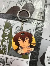 Llavero redondo con imagen de Dazai Osamu del anime Bungō Stray Dogs.