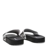 Chancletas Tiffosi modelo Boots Cruz, con base negra y tira ancha blanca con estampado geométrico en negro.