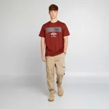 Pantalón de jogging color beige con bolsillos cargo con solapa.