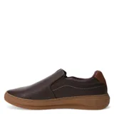 Zapato tipo slip-on de cuero color marrón oscuro, con diseño ergonómico, elásticos laterales para un calce fácil y suela de goma color caramelo.