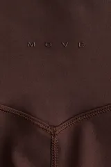 Leggings deportivas de tiro alto color marrón oscuro, confeccionadas en tejido funcional con tecnología SoftMove™ y DryMove™ para suavidad y absorción de sudor.