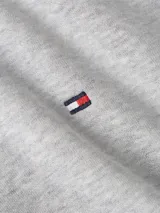 Buzo gris con capucha y cierre de cremallera, con logo de Tommy Hilfiger bordado en el pecho.