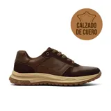Championes casuales Hanker modelo Regino, confeccionados en combinación de cuero liso y gamuza en tonos marrones. Presentan paneles perforados, cordones al tono y una suela de goma dentada en color beige.