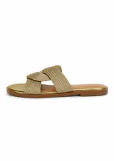 Sandalias planas Zingara de color dorado, con capellada de tiras cruzadas en tejido trenzado y plantilla metalizada.