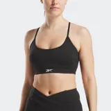 Sostén deportivo negro con tirantes finos que forman un patrón triangular en la espalda y logo de Reebok en el frente.