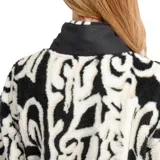 Buzo de polar O'Neill con diseño estampado en blanco y negro, cuello alto con medio cierre frontal, mangas largas y bolsillos laterales.